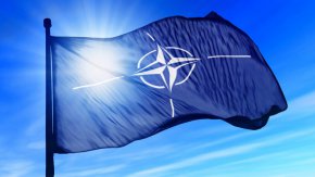 Постът е придружен от видео от въпросната дата, на което се вижда издигането на българския флаг в щаб-квартирата на Алианса в Брюксел, но без  ревящия външен Соломон Паси.

